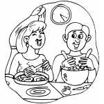 Couple Laughing And Cooking Dinner